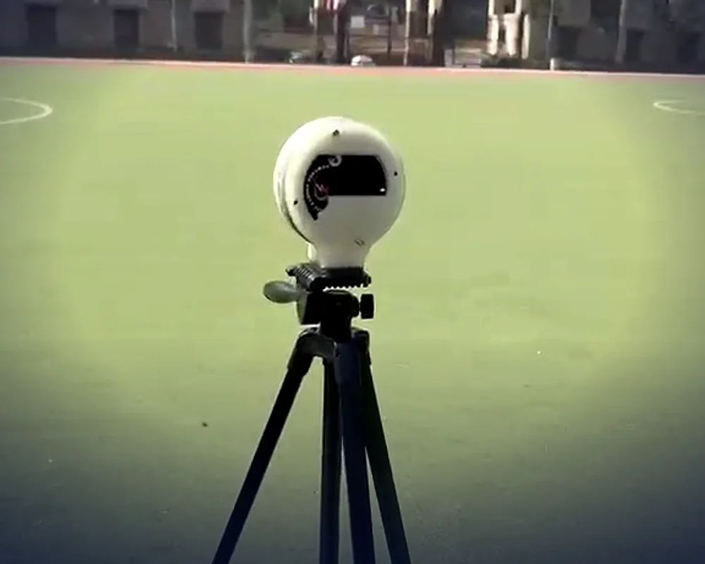 PeakSpot timing gate on a tripod at a sports field